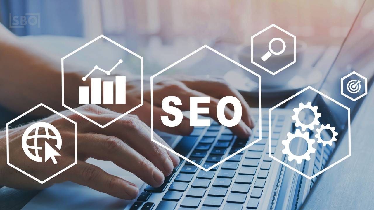 Hands typing on laptop for SEO optimization