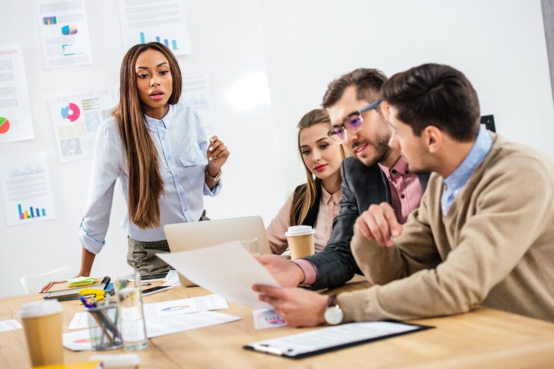 Team discussing project in office meeting