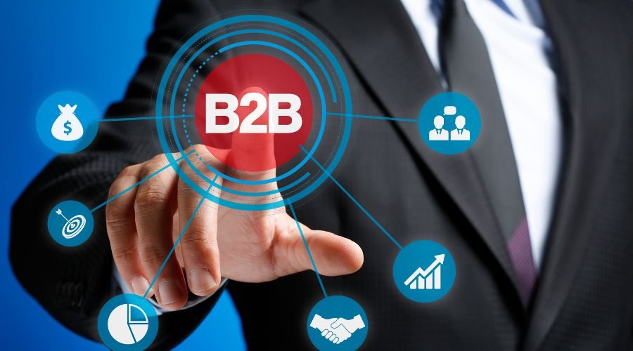 Businessman tapping B2B on digital interface.