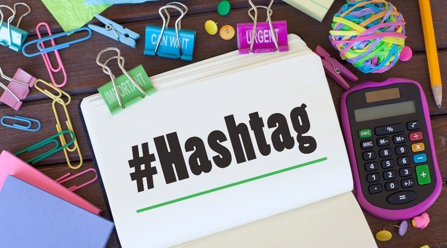 Hashtag sign with office supplies and calculator