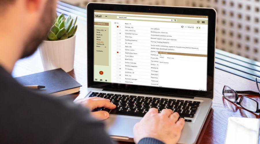 Person checking emails on a laptop.