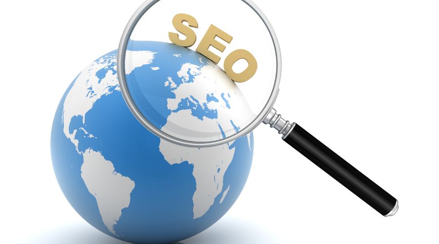 SEO magnifying glass over globe