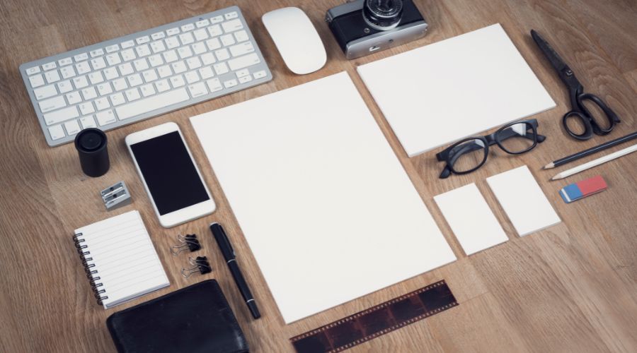 Office supplies neatly arranged on wooden desk.