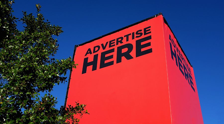 Large red billboard for advertisement space.