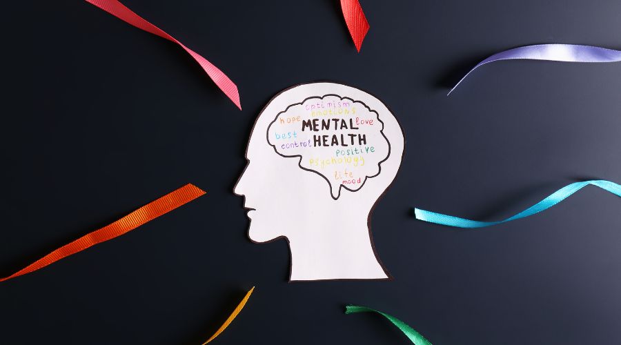 Mental health illustration with colorful ribbons.