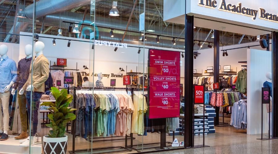 Clothing store with discounts on shorts and shirts.