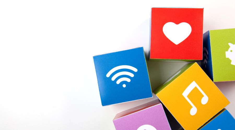 Colorful blocks with heart, WiFi, music icons.