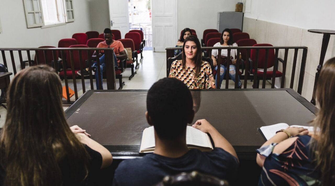 Students sitting for an exam in a classroom.