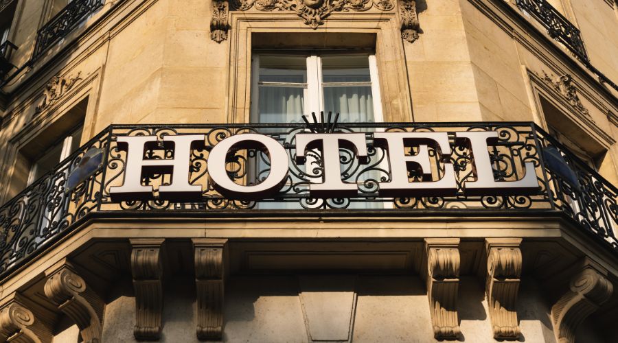 Hotel sign on building balcony exterior