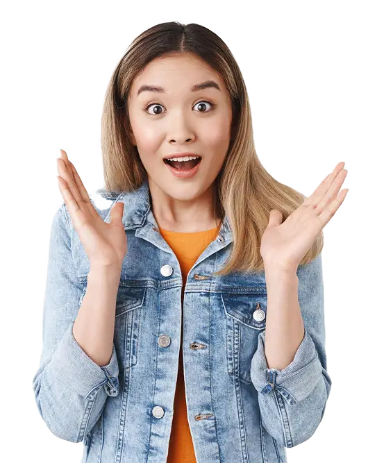 Surprised woman with hands up in denim jacket.