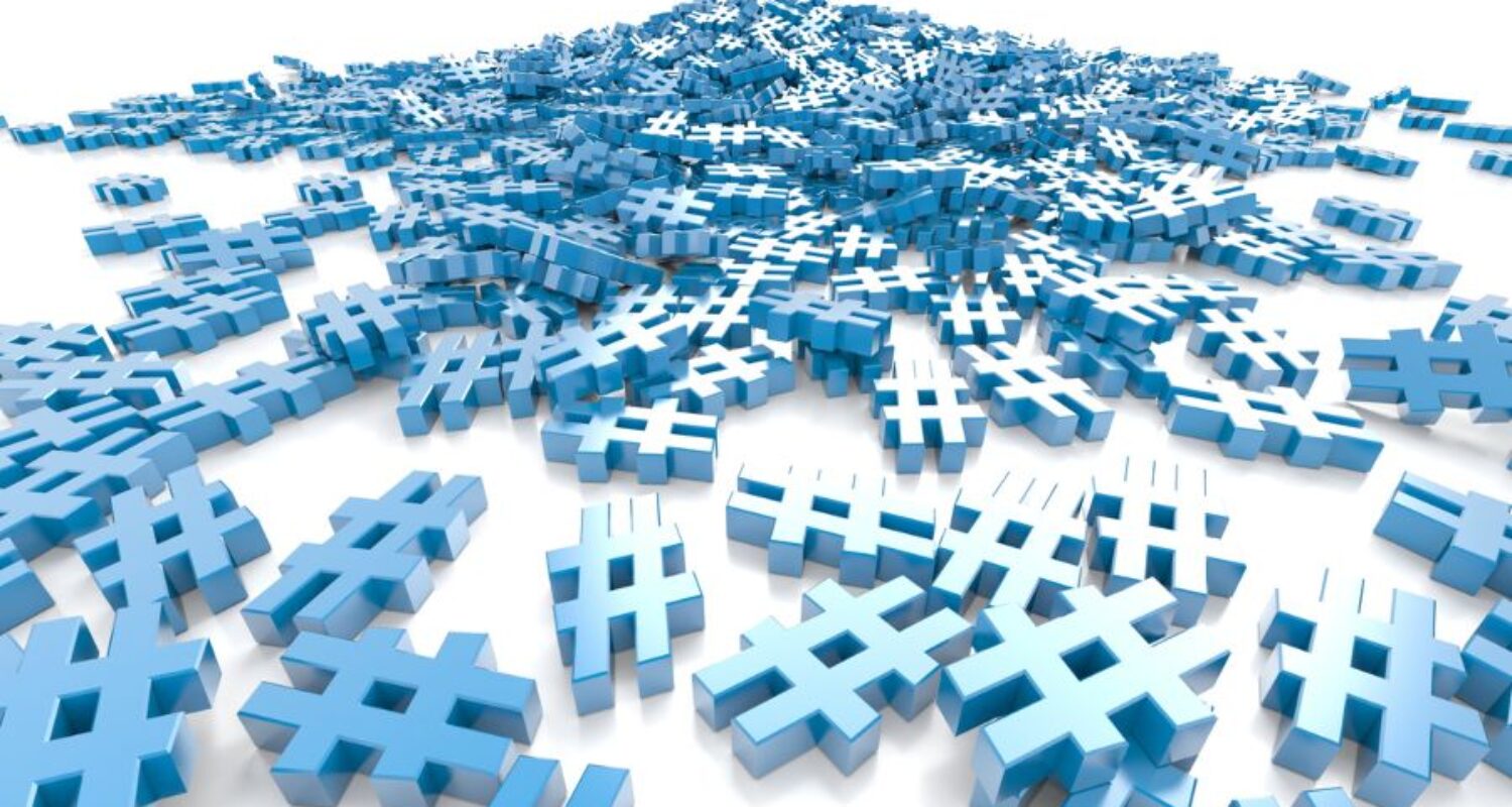 Pile of blue hashtag symbols on white background.