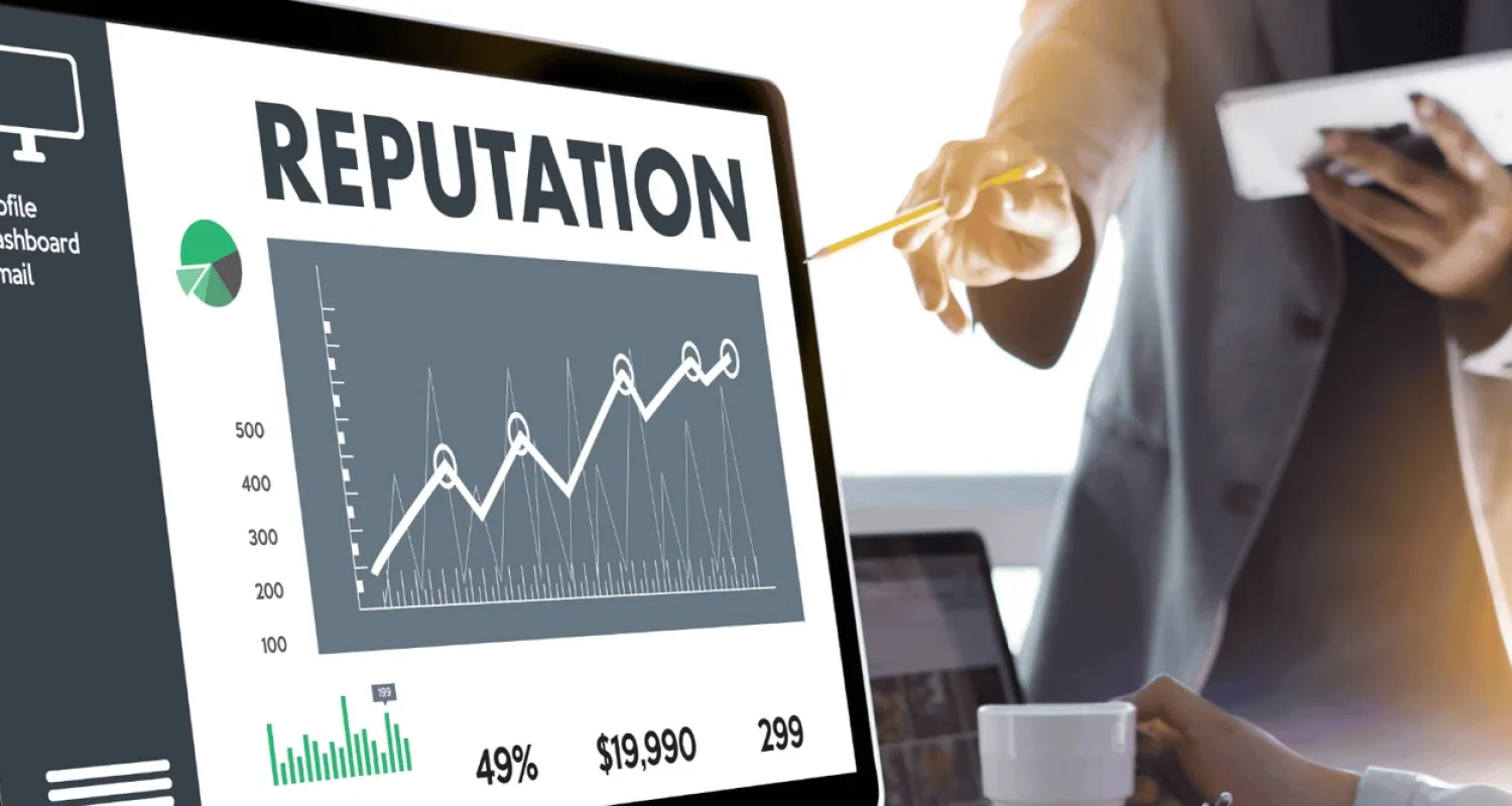Reputation dashboard with analytics graph on computer screen.